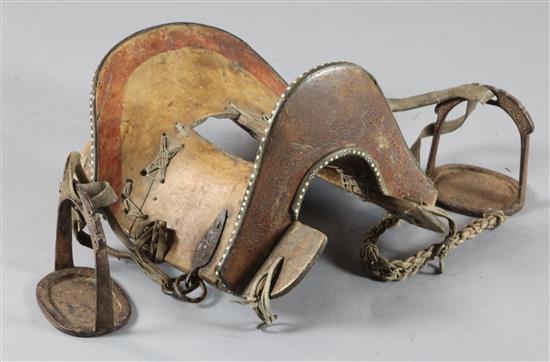 A Chinese inlaid wood saddle and a pair of iron stirrups, 19th century, 48cm long